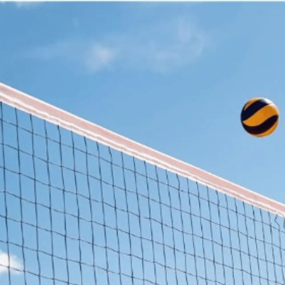Garware Sportiva volleyball net installed on an outdoor court with ball in play